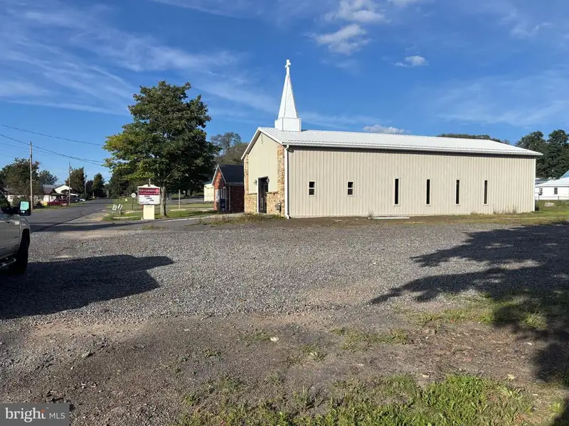 Versatile Metal Frame Building with Parking Lot in Prime Location, 0.33 Acres