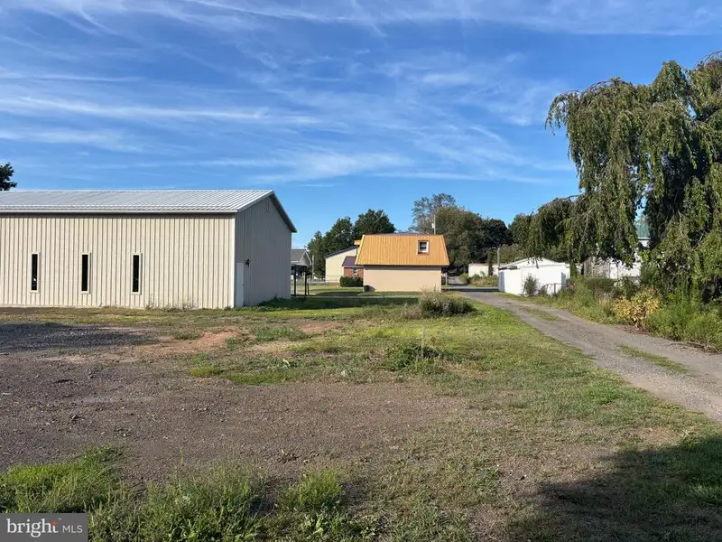 Versatile Metal Frame Building with Parking Lot in Prime Location, 0.33 Acres