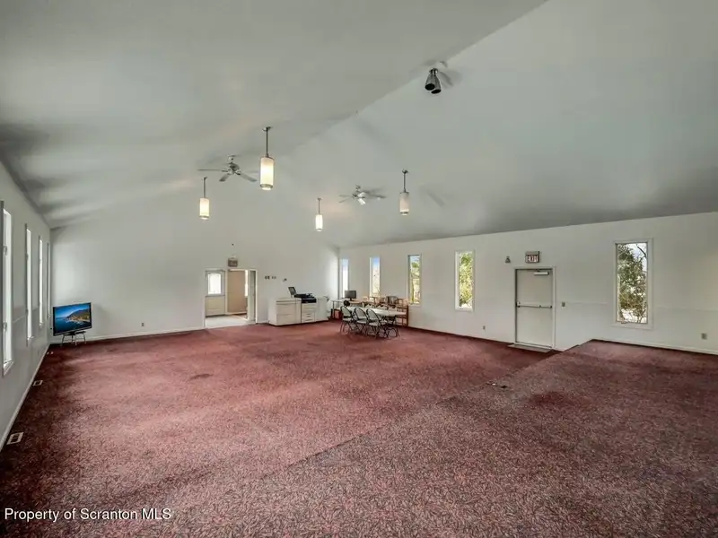 Versatile Former Church Building in Peaceful Location with Ample Parking and Creative Potential