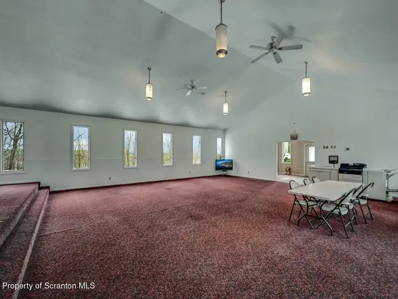 Versatile Former Church Building in Peaceful Location with Ample Parking and Creative Potential