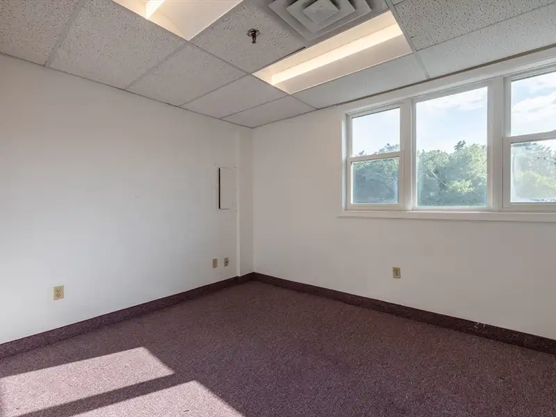 Freestanding Four-story Office Building with Parking on Route 114, North Andover
