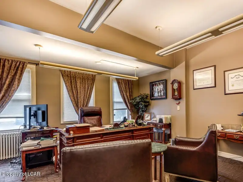 Versatile Office Building in Central Kingston with Multiple Offices and Ample Parking