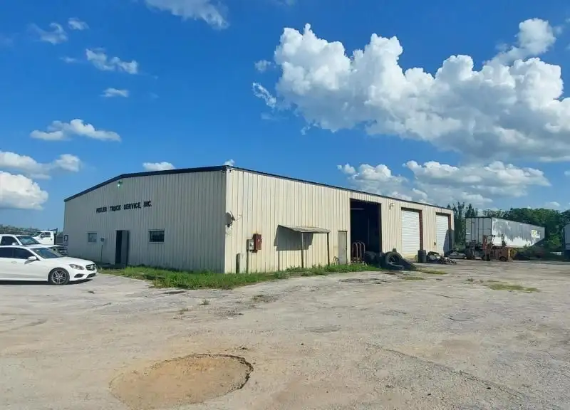 10.94-acre Commercial Property with 7,500 Sq Ft Warehouse on State Rd 46 Frontage