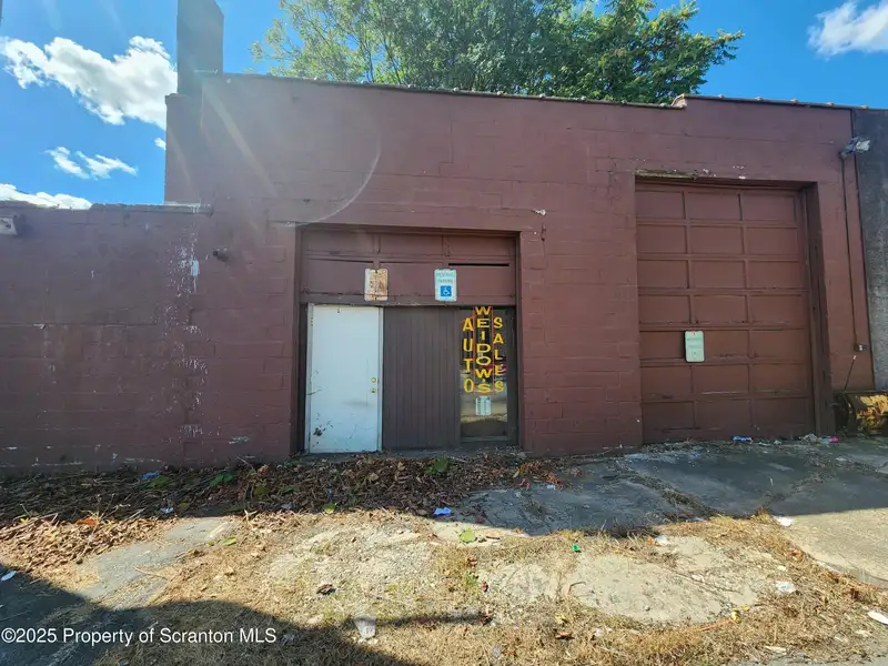 Versatile Commercial Property with Garage Bays and Billboard Income in Prime Location