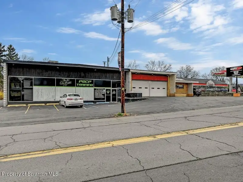 Mixed-use Building with Retail Space and Parking for Sale in Prime Location