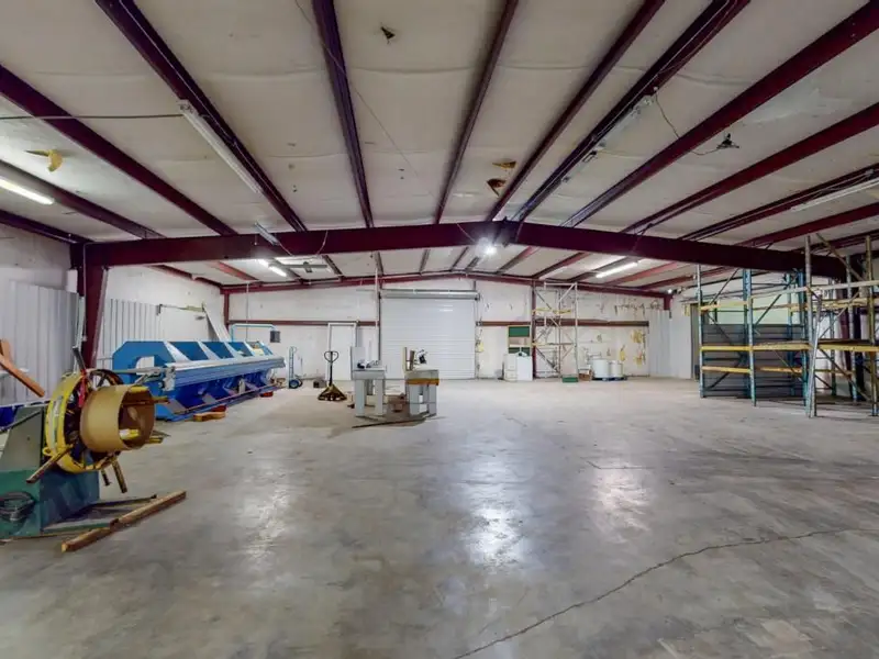 Commercial Property on Busy Highway - 2.1 Acres, 31,000 Sq Ft with Offices and Roll-up Doors
