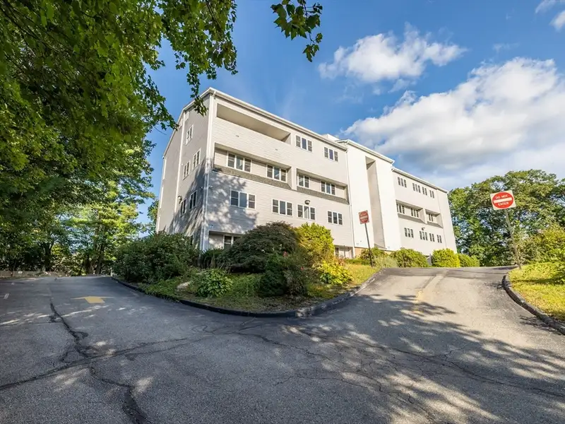 Freestanding Four-story Office Building with Parking on Route 114, North Andover