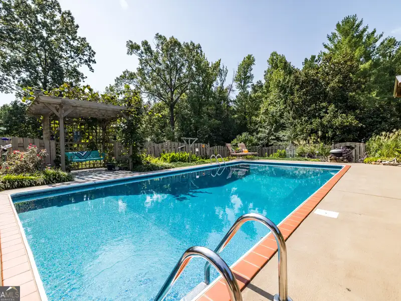 27 Acres with 2,400 Sq. Ft. Home, Duplexes, Pool, and Barn in Prime Location