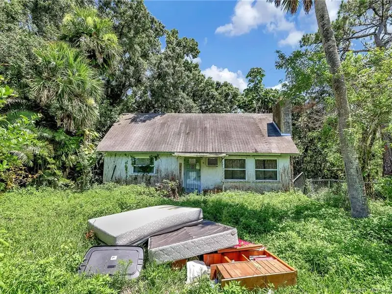 Commercial Corner Lot with Existing Residence in Lakewood Park, 31,140 Sq Ft