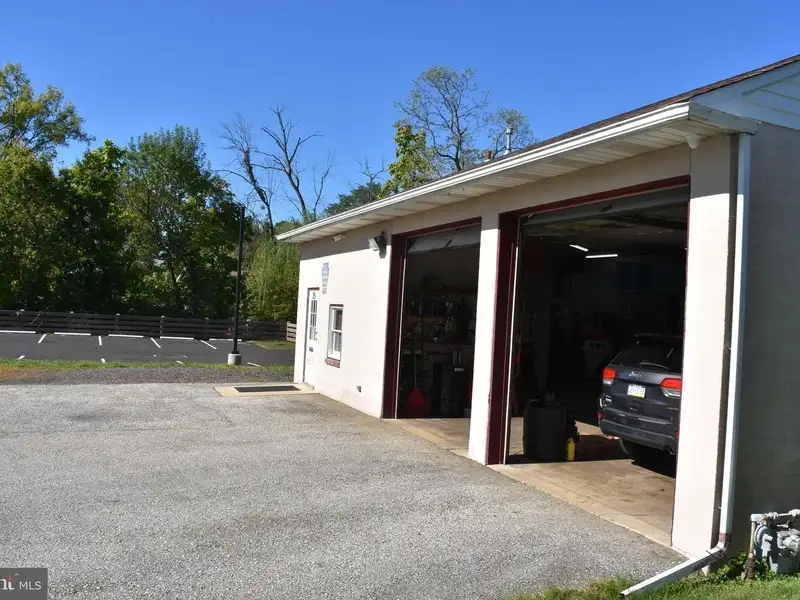 Versatile 3000+ Sq Ft Commercial Space in Prime Village Location with Auto Repair Facilities