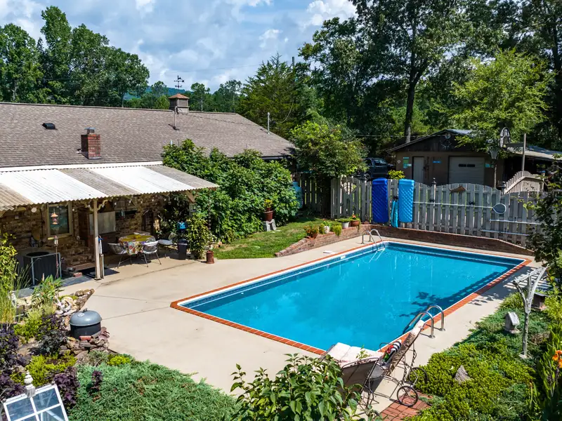 27 Acres with 2,400 Sq. Ft. Home, Duplexes, Pool, and Barn in Prime Location