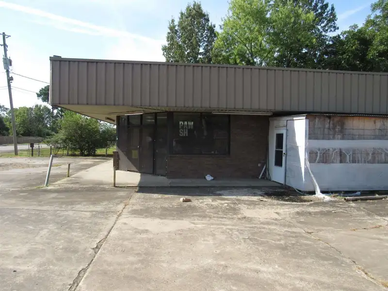 Versatile Commercial Property Near County Fair Grounds with Gas Station and Retail Potential