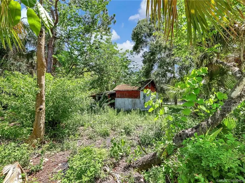 Commercial Corner Lot with Existing Residence in Lakewood Park, 31,140 Sq Ft