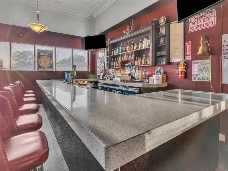 Versatile Corner Commercial Property with Retail Space and Two Apartments in Prime Location