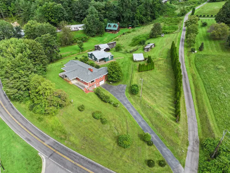 Prime 2.58-acre Multifunctional Property with Ranch Home and Outbuildings Near High-traffic Area