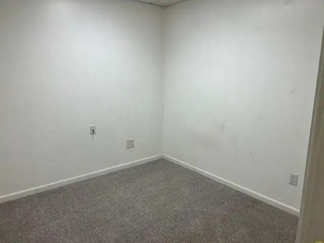 Versatile Commercial Property with 6000 Sq Ft Building and One-bedroom Apartment in Prime Location