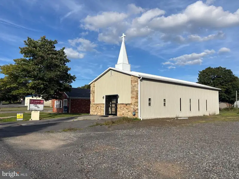 Versatile Metal Frame Building with Parking Lot in Prime Location, 0.33 Acres