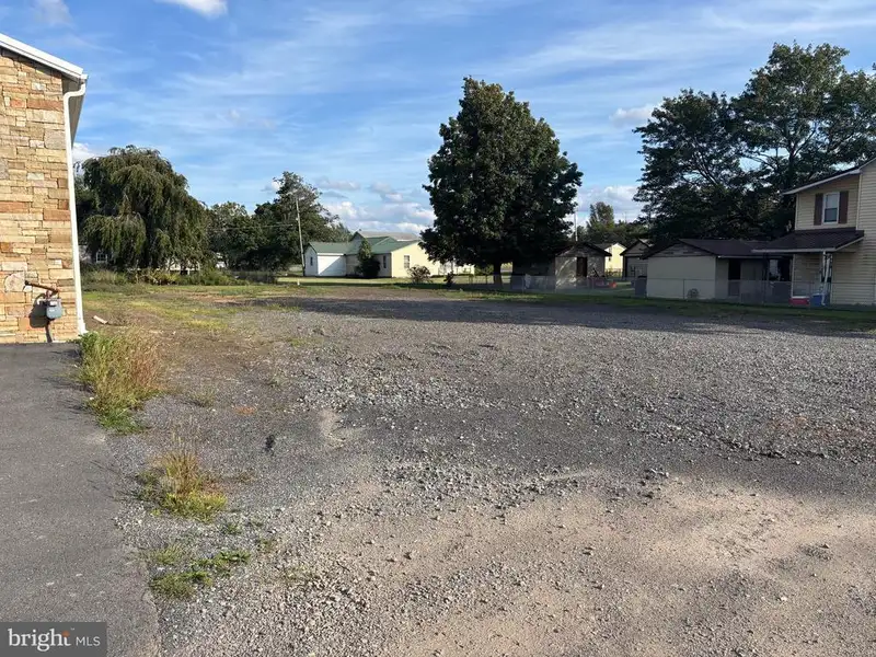 Versatile Metal Frame Building with Parking Lot in Prime Location, 0.33 Acres