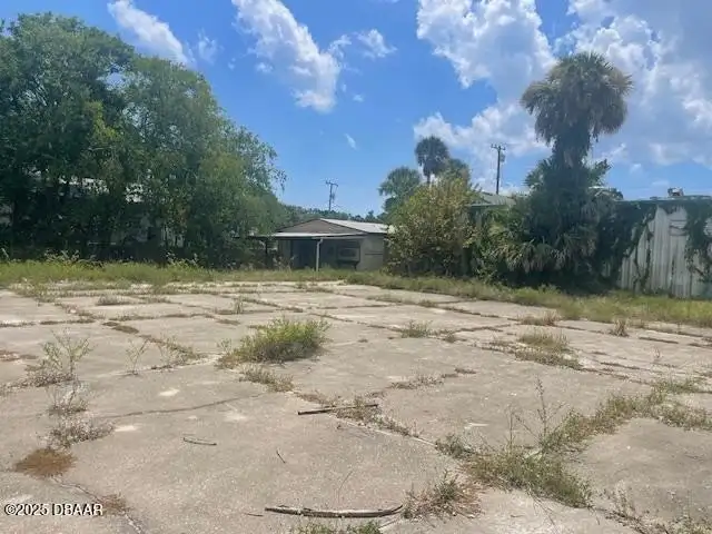 Multi-parcel Offering: Two-story Building with Renovation Potential in Prime Location