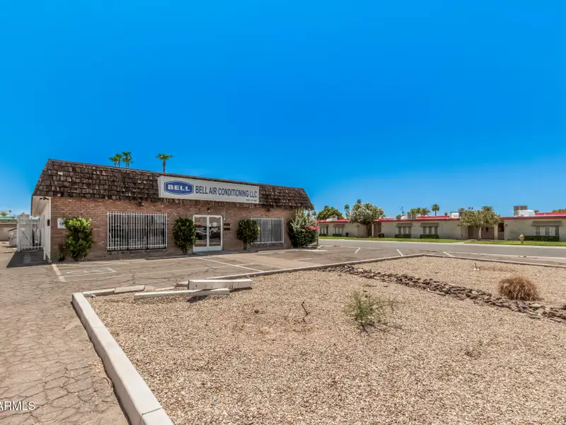 Versatile Commercial Property with Two Buildings and Ample Parking in Prime Location