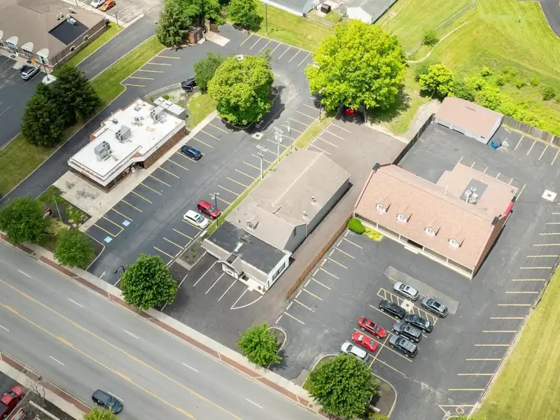 Prime Commercial Building in Downtown Reynoldsburg with Parking and Industrial Garage