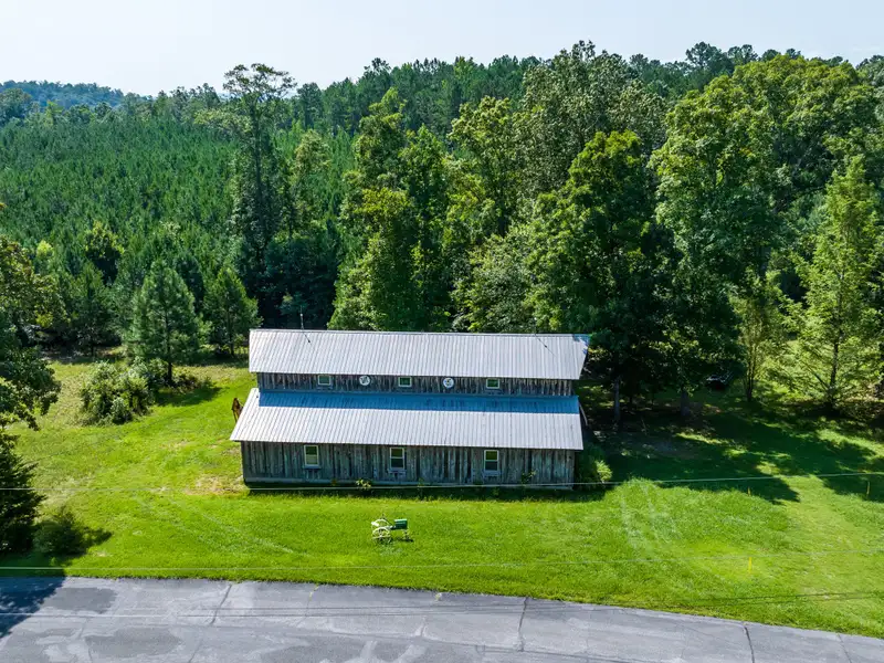 27 Acres with 2,400 Sq. Ft. Home, Duplexes, Pool, and Barn in Prime Location