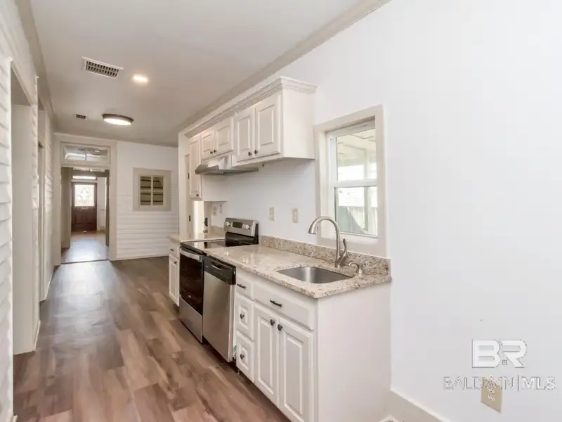 Mixed-use Property in Downtown Mobile, Alabama with High Ceilings and Hardwood Floors