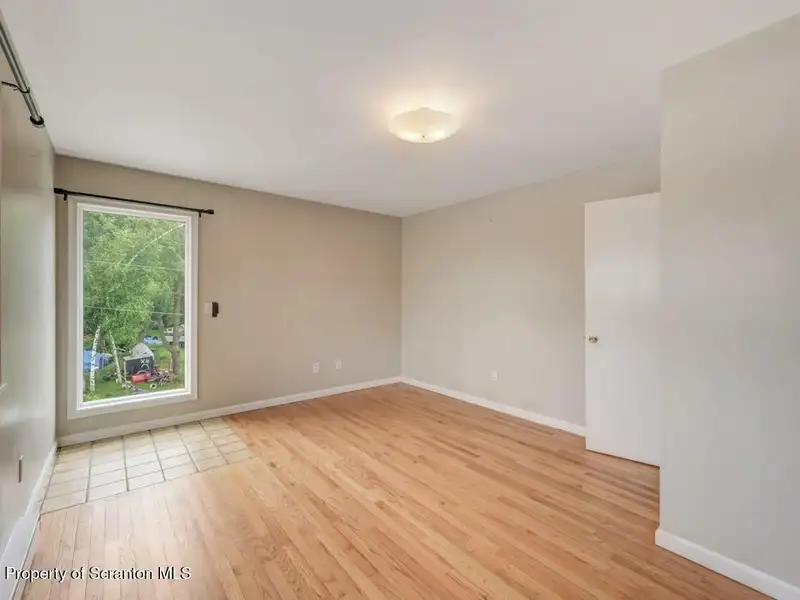 Mixed-use Property in Throop: 7-bay Garage and Updated 2-bedroom Apartment