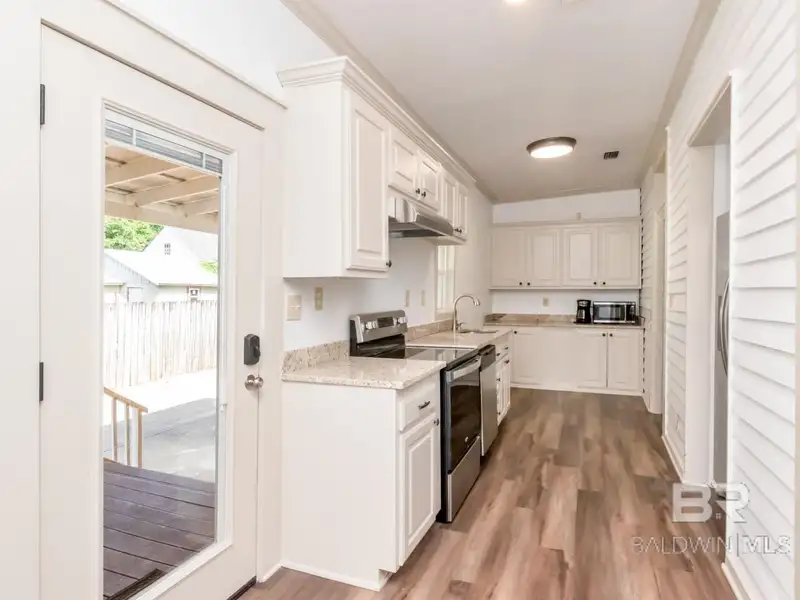 Mixed-use Property in Downtown Mobile, Alabama with High Ceilings and Hardwood Floors