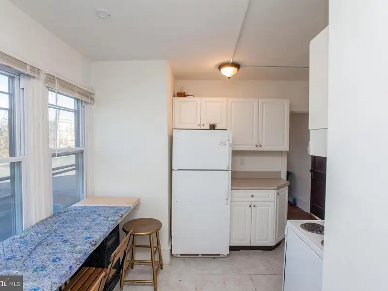 Multi-unit Building with Commercial Space and Two Residential Apartments in Established Location