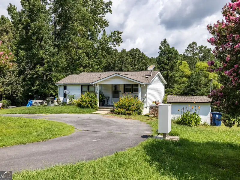 27 Acres with 2,400 Sq. Ft. Home, Duplexes, Pool, and Barn in Prime Location