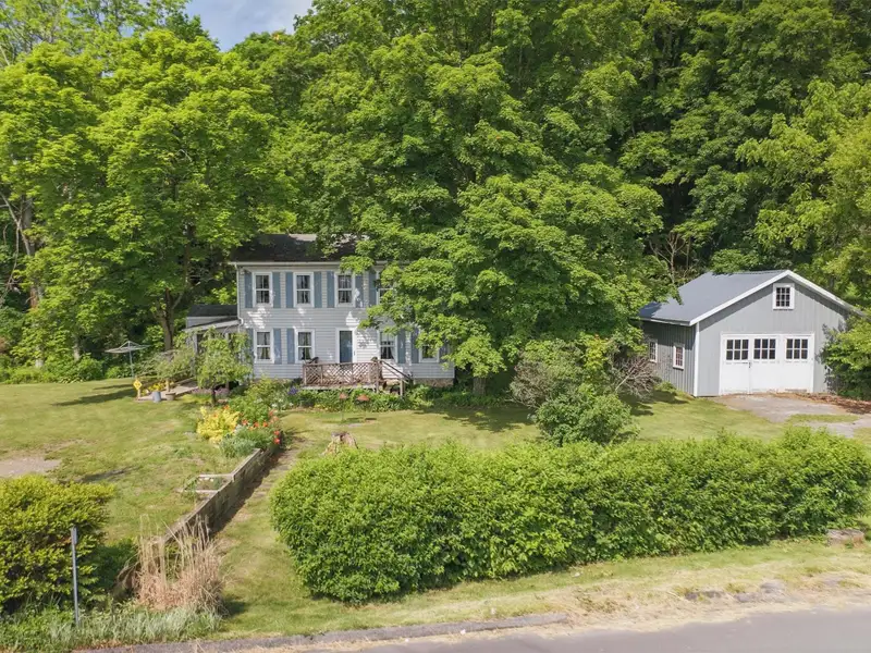 Commercial Retail/warehouse with Charming Colonial Home in High-traffic Corner Location
