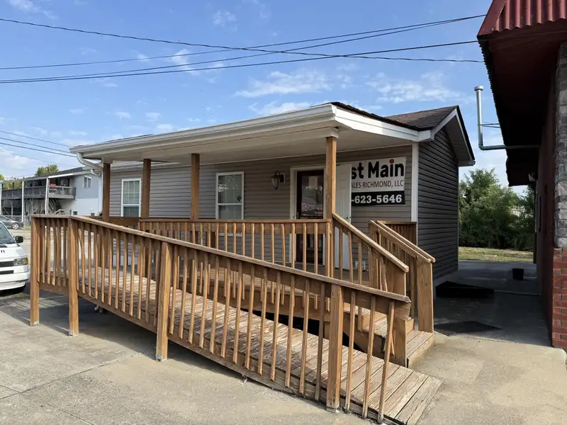 Prime Commercial Property with Office and Garage Space at Lake and East Main Intersection