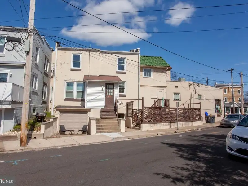 Multi-unit Building with Commercial Space and Two Residential Apartments in Established Location
