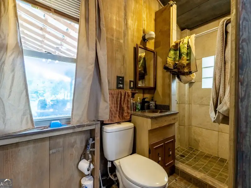 27 Acres with 2,400 Sq. Ft. Home, Duplexes, Pool, and Barn in Prime Location