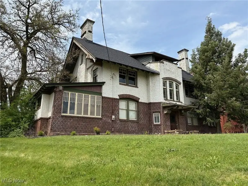 Updated Tudor Office Building with Residential Potential in Canton Near Downtown