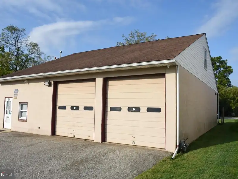 Versatile 3000+ Sq Ft Commercial Space in Prime Village Location with Auto Repair Facilities