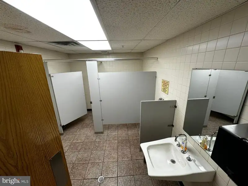 Versatile Commercial Property with Showroom, Offices, and Large Metal Building in Prime Location