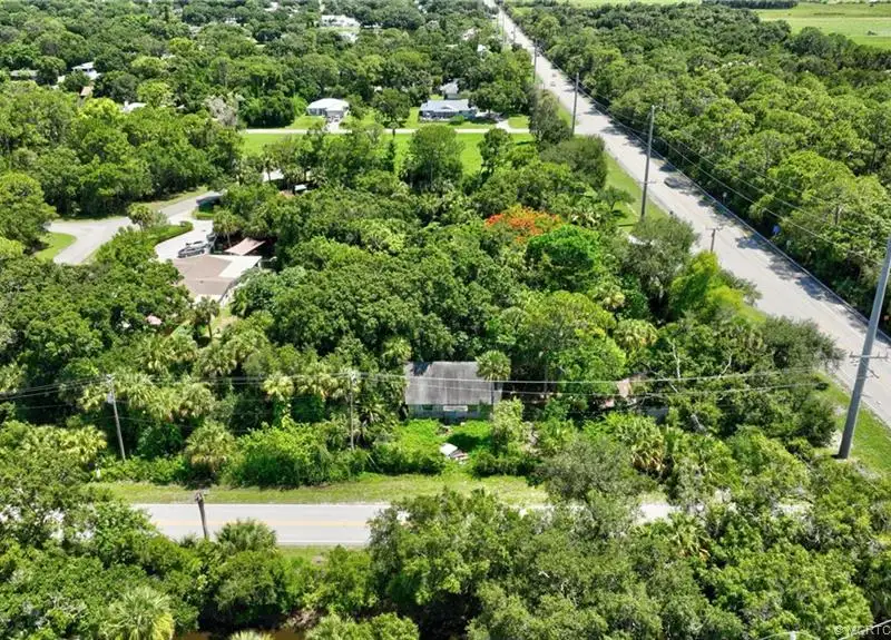 Commercial Corner Lot with Existing Residence in Lakewood Park, 31,140 Sq Ft