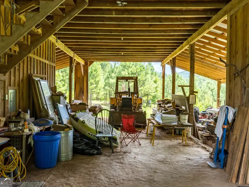 27 Acres with 2,400 Sq. Ft. Home, Duplexes, Pool, and Barn in Prime Location