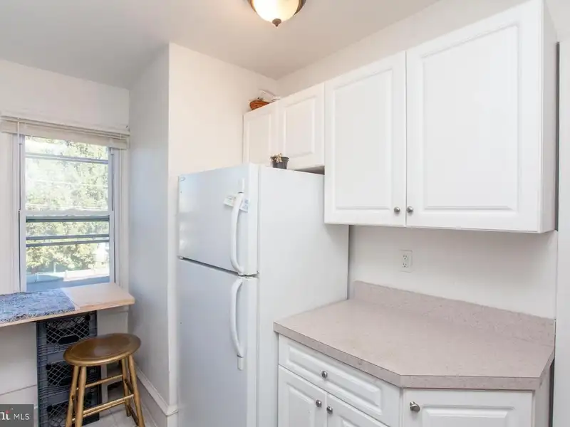 Multi-unit Building with Commercial Space and Two Residential Apartments in Established Location