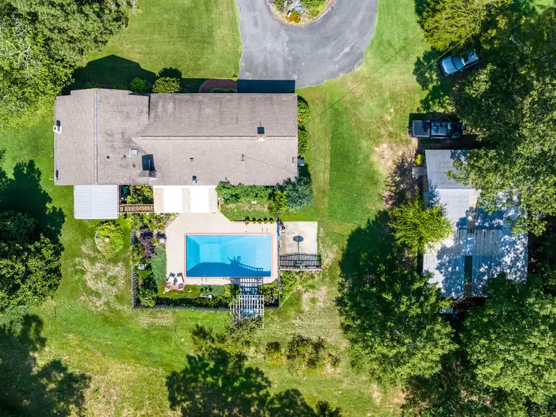 27 Acres with 2,400 Sq. Ft. Home, Duplexes, Pool, and Barn in Prime Location