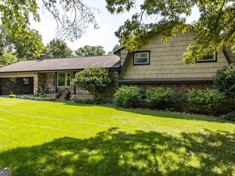 27 Acres with 2,400 Sq. Ft. Home, Duplexes, Pool, and Barn in Prime Location