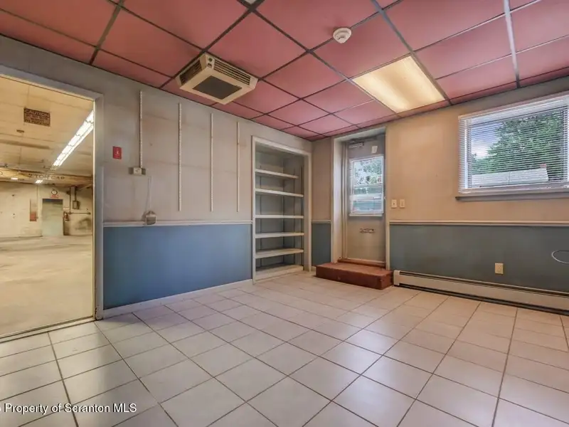 Mixed-use Property in Throop: 7-bay Garage and Updated 2-bedroom Apartment