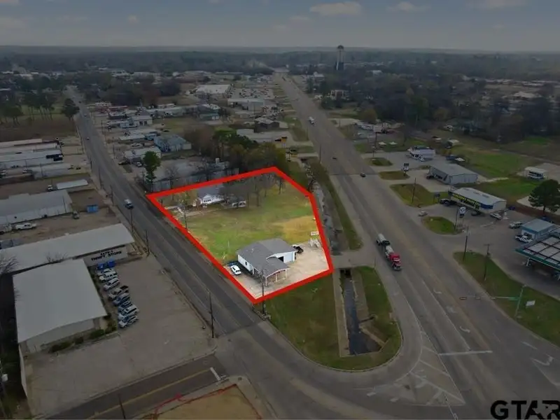 Prime Commercial Property with Building and Home on Half Acre Lot