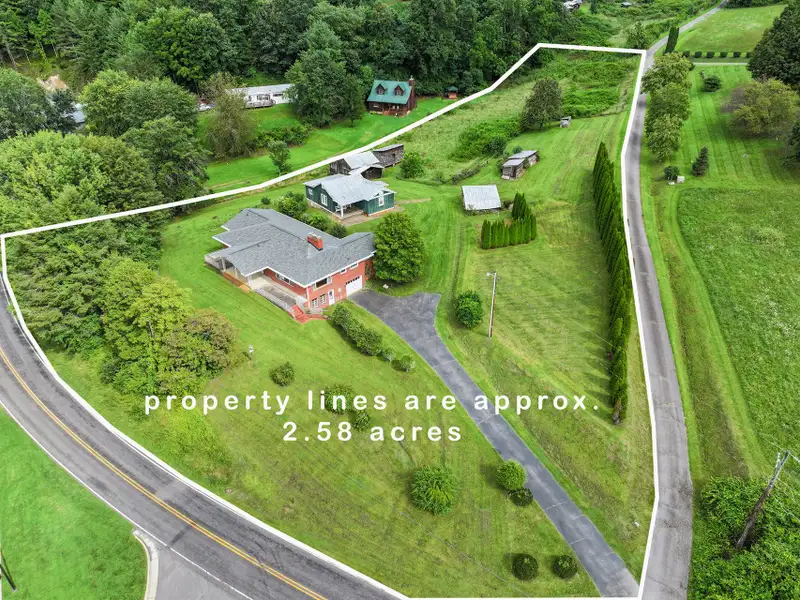 Prime 2.58-acre Multifunctional Property with Ranch Home and Outbuildings Near High-traffic Area