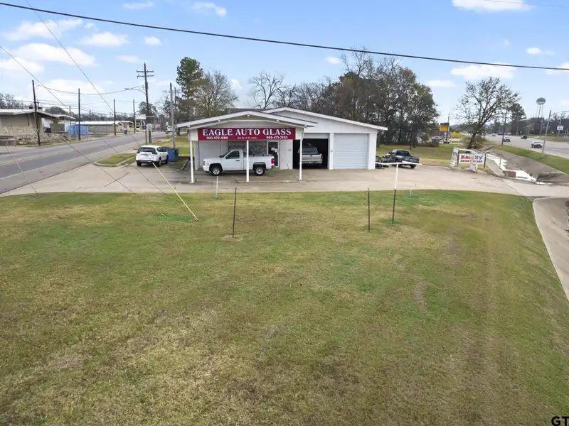 Prime Commercial Property with Building and Home on Half Acre Lot