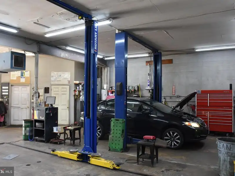 Versatile 3000+ Sq Ft Commercial Space in Prime Village Location with Auto Repair Facilities