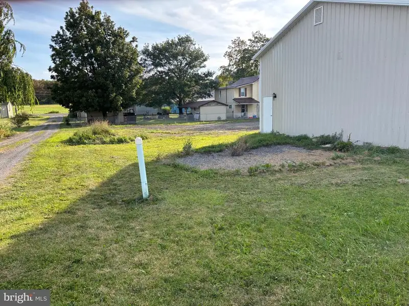 Versatile Metal Frame Building with Parking Lot in Prime Location, 0.33 Acres