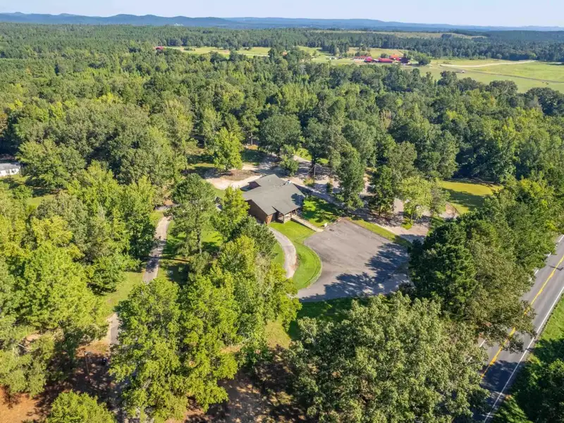 Established Log Cabin Liquor Store for Sale on Highway 70 with Drive-through Access
